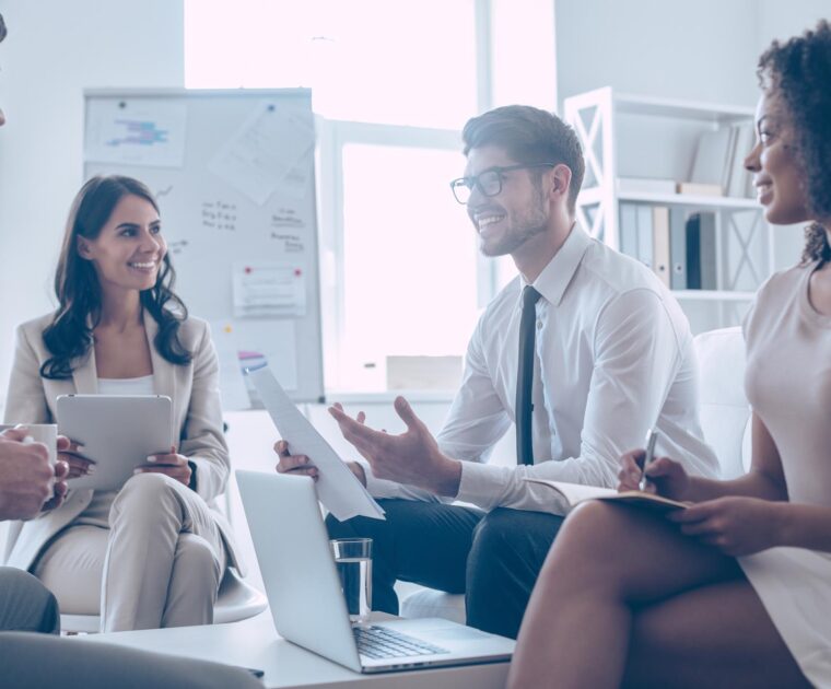 an entry-level worker speaking with coworkers