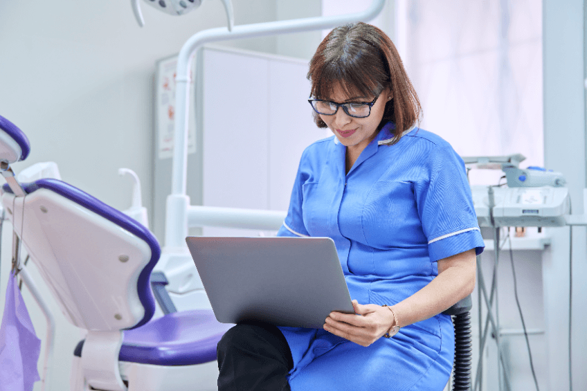 female healthcare worker using a laptop