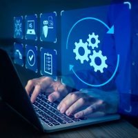 an automation icon floating above someone using a laptop