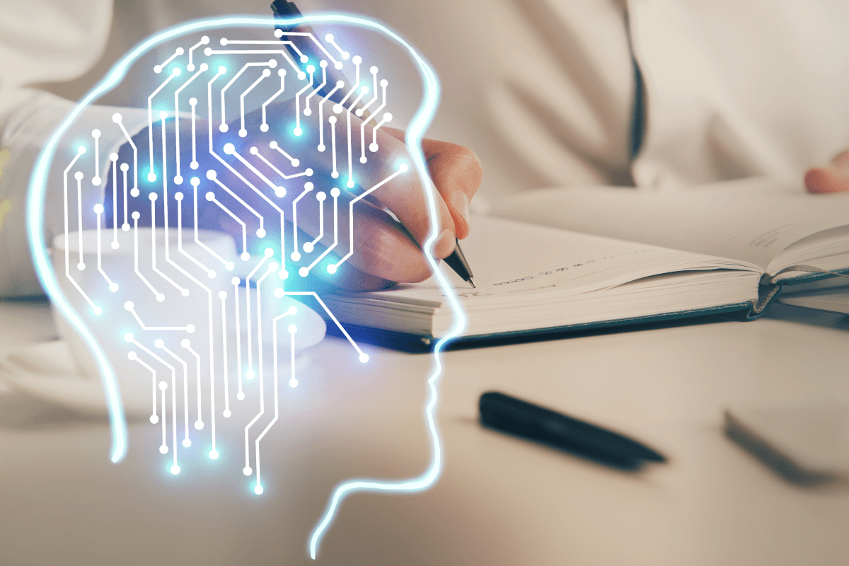 ai icon on top of a person writing in a book
